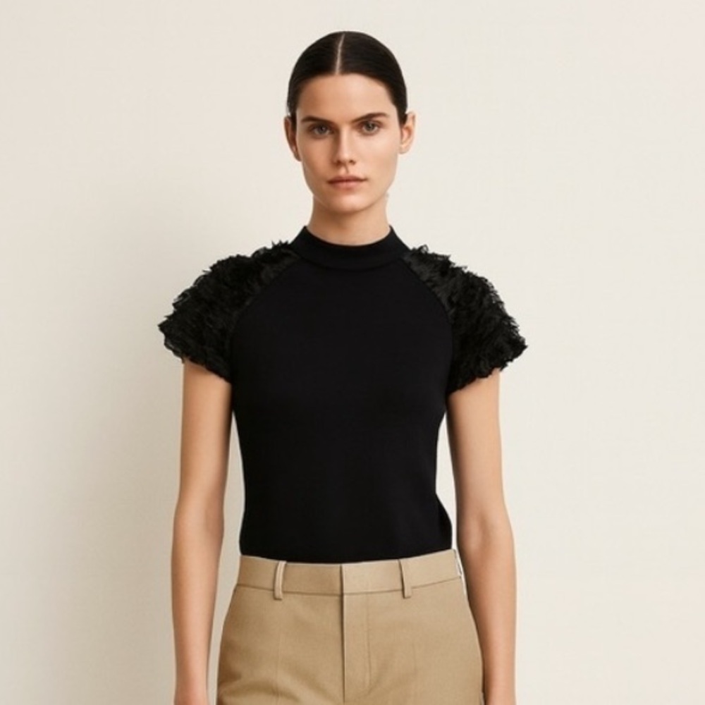 Machka black jersey short sleeve top with sleeve detail. Size Large